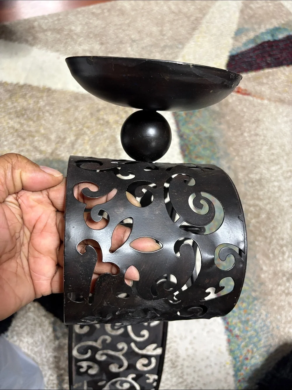 One Pier One Black Metal Scroll Wall Sconce.